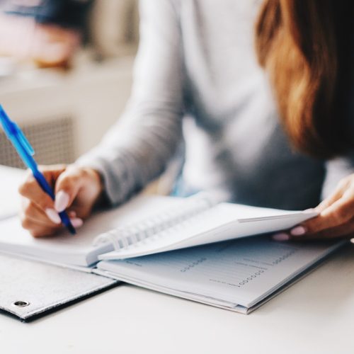 marissa-grootes-N9uOrBICcjY-unsplash nurse practitioner schedule an appoint writing in a notebook